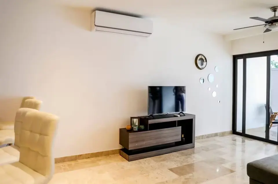 Cozy living space with smart TV; unwind after a day of exploring.