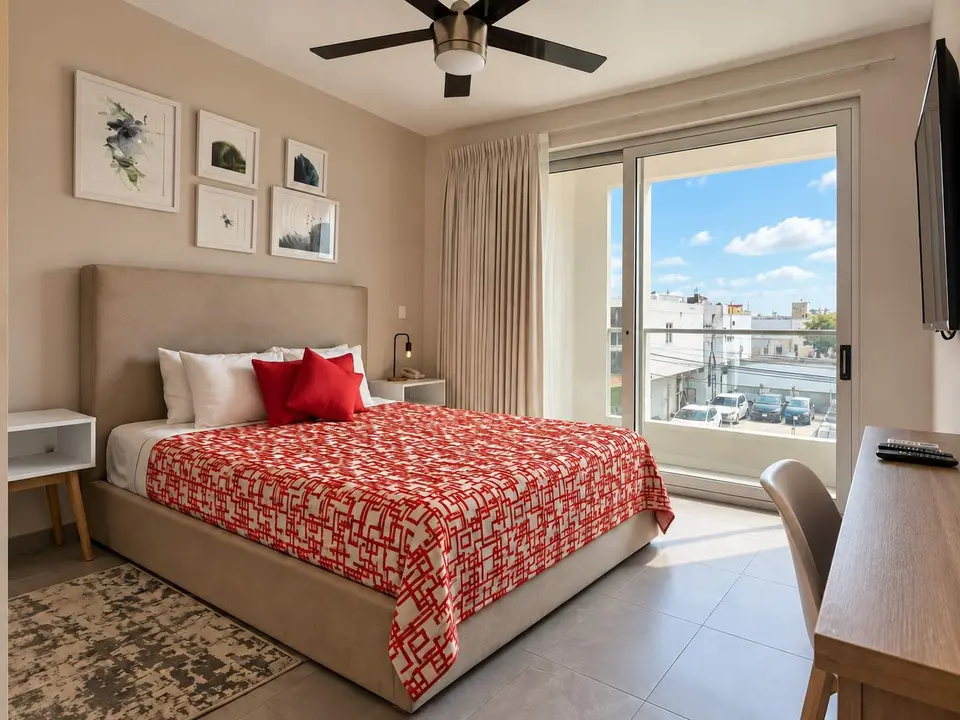 The second bedroom is spacious and has a private balcony.