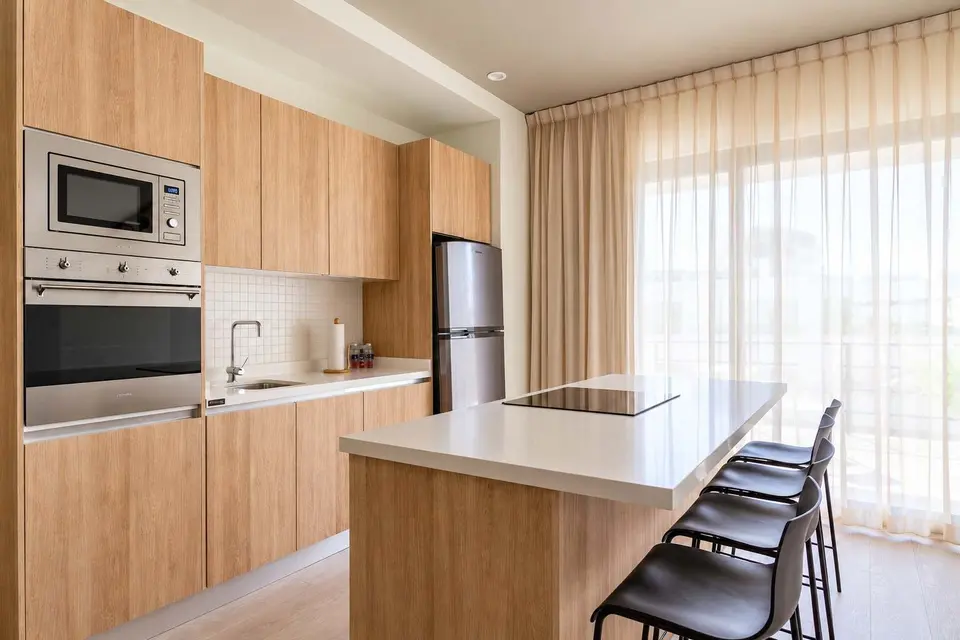 A dining area where you can prepare all your meals just like in the comfort of your own home (spacious refrigerator, microwave, oven, and plenty of light)