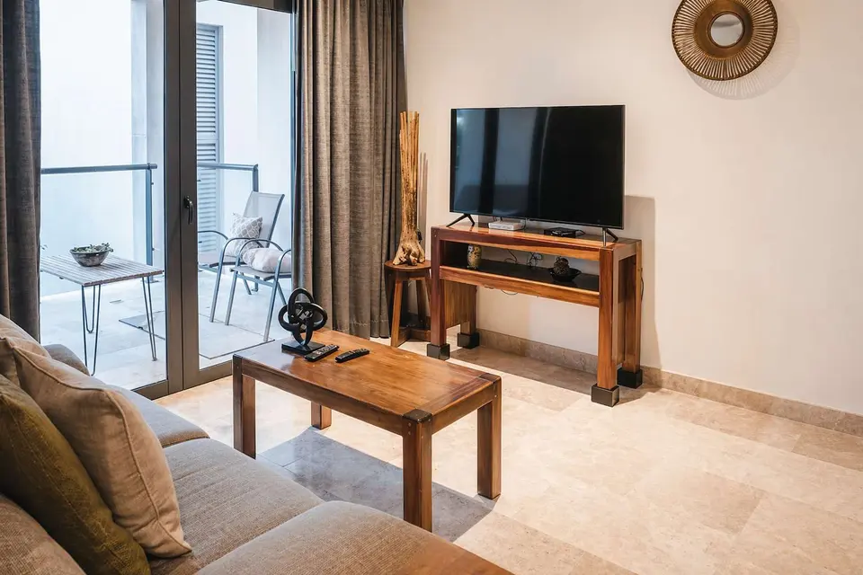 Cozy living space with smart TV; unwind after a day of exploring.