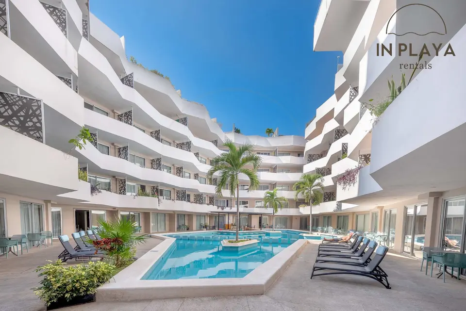 Sparkling pool & lush landscaping await! Relax & unwind.