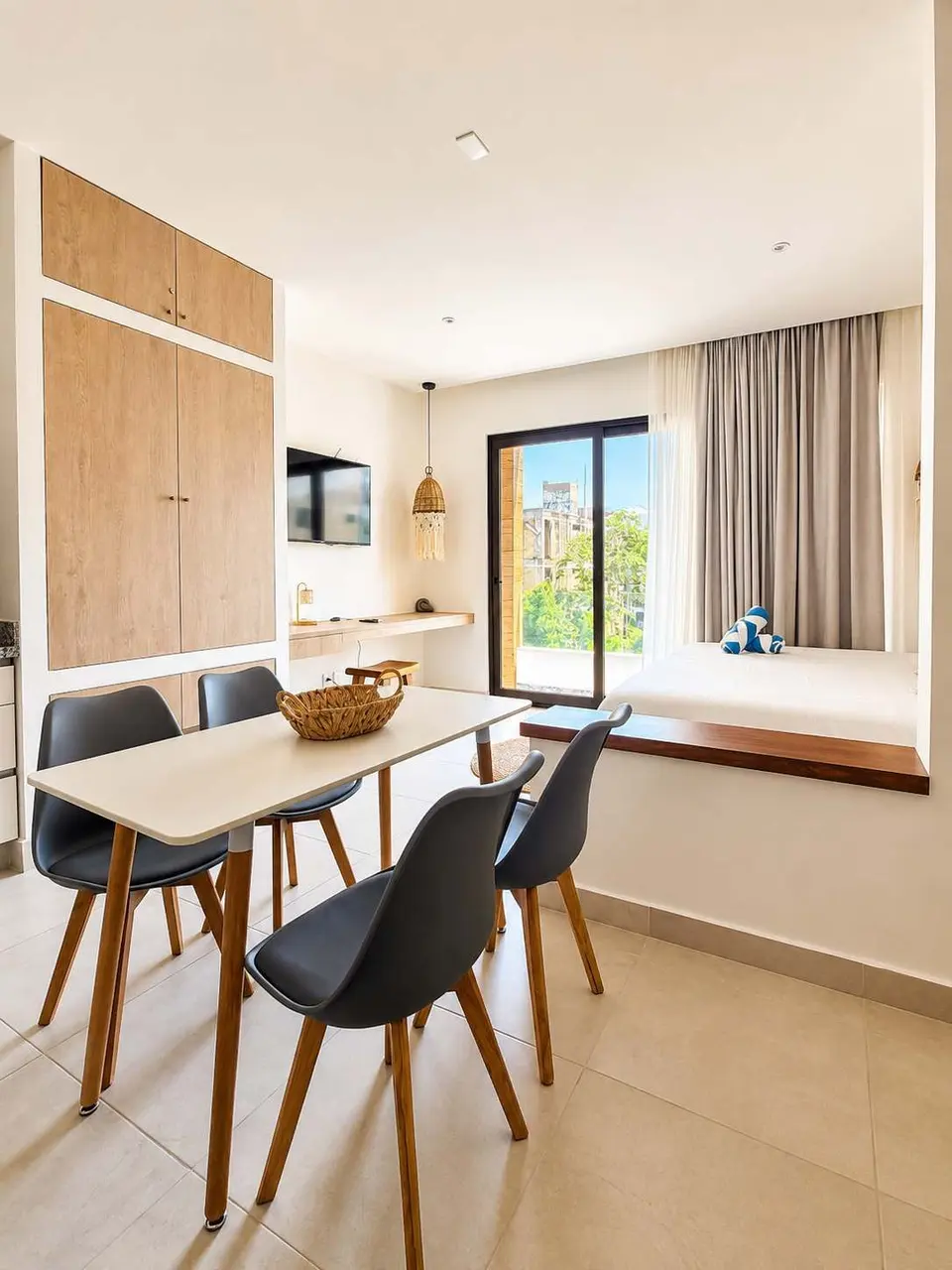 An open and bright space where you can enjoy breakfast, get some work done, or relax after the beach — with a private balcony and a layout designed to make the most of every moment of your stay.
