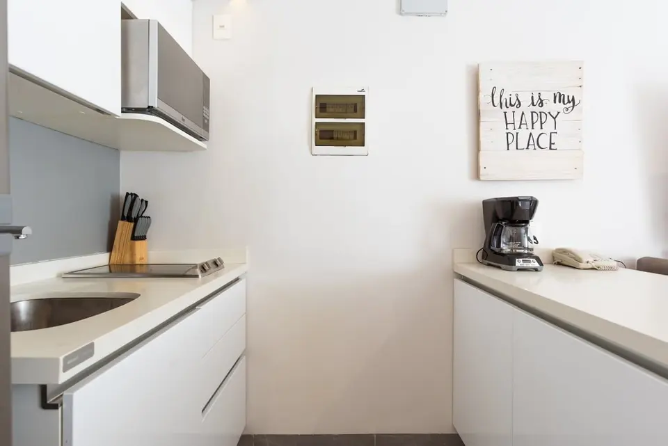 Fully equipped kitchen with modern appliances.