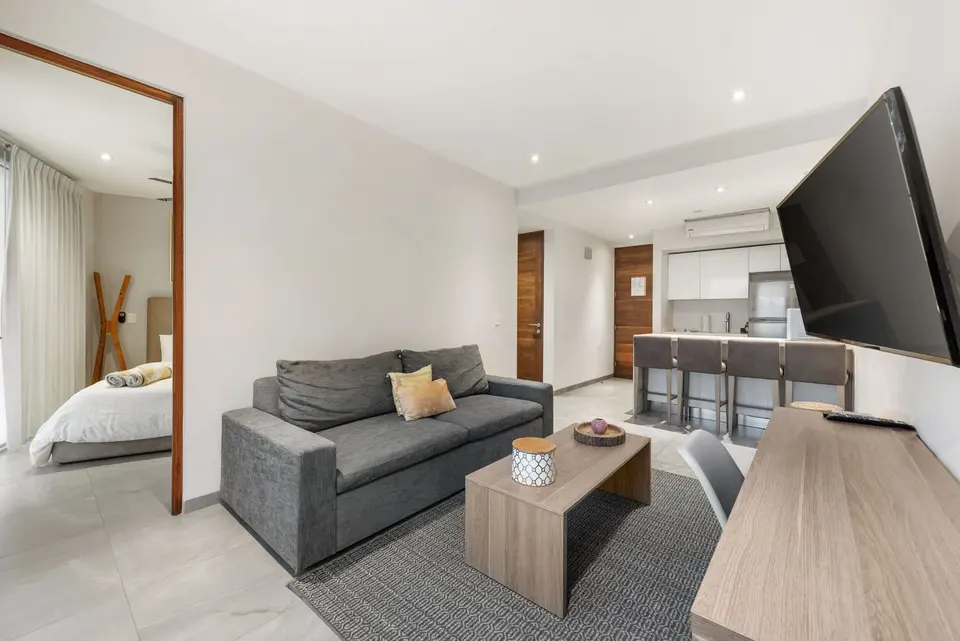 Chill out between pool dips in this inviting living area with smart TV.
