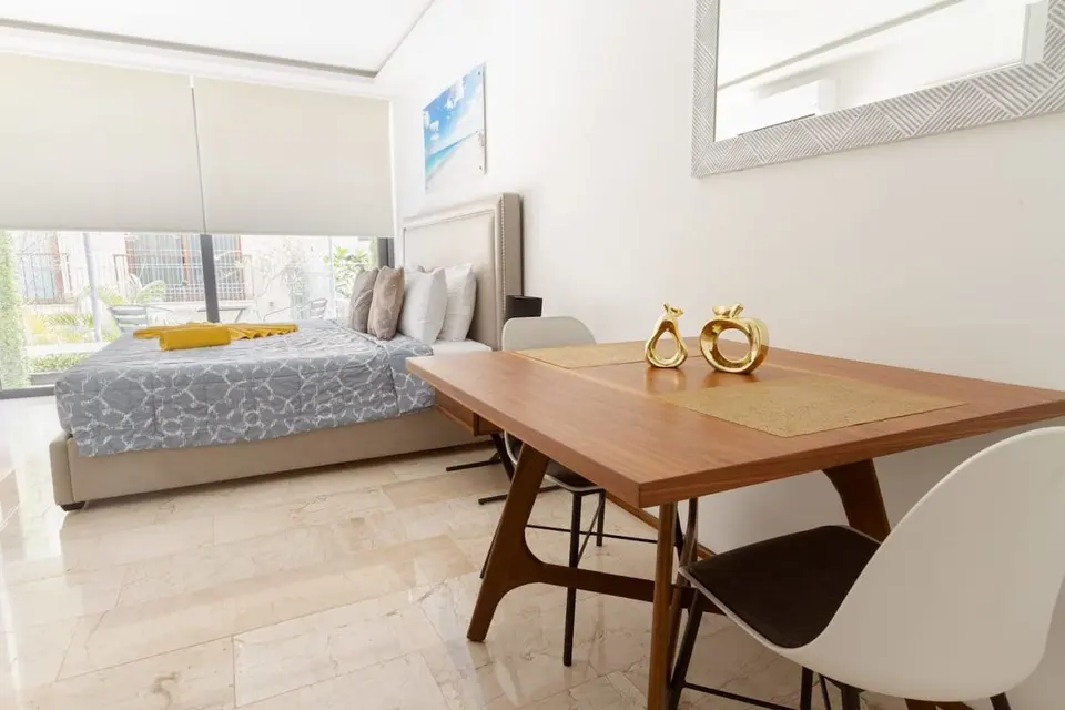 Studio with king bed, equipped kitchen and pool access; wake up just steps from the beach