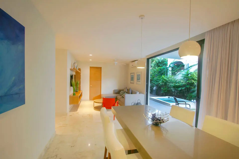 The living room is the heart of the apartment. TV, sofa and dining area