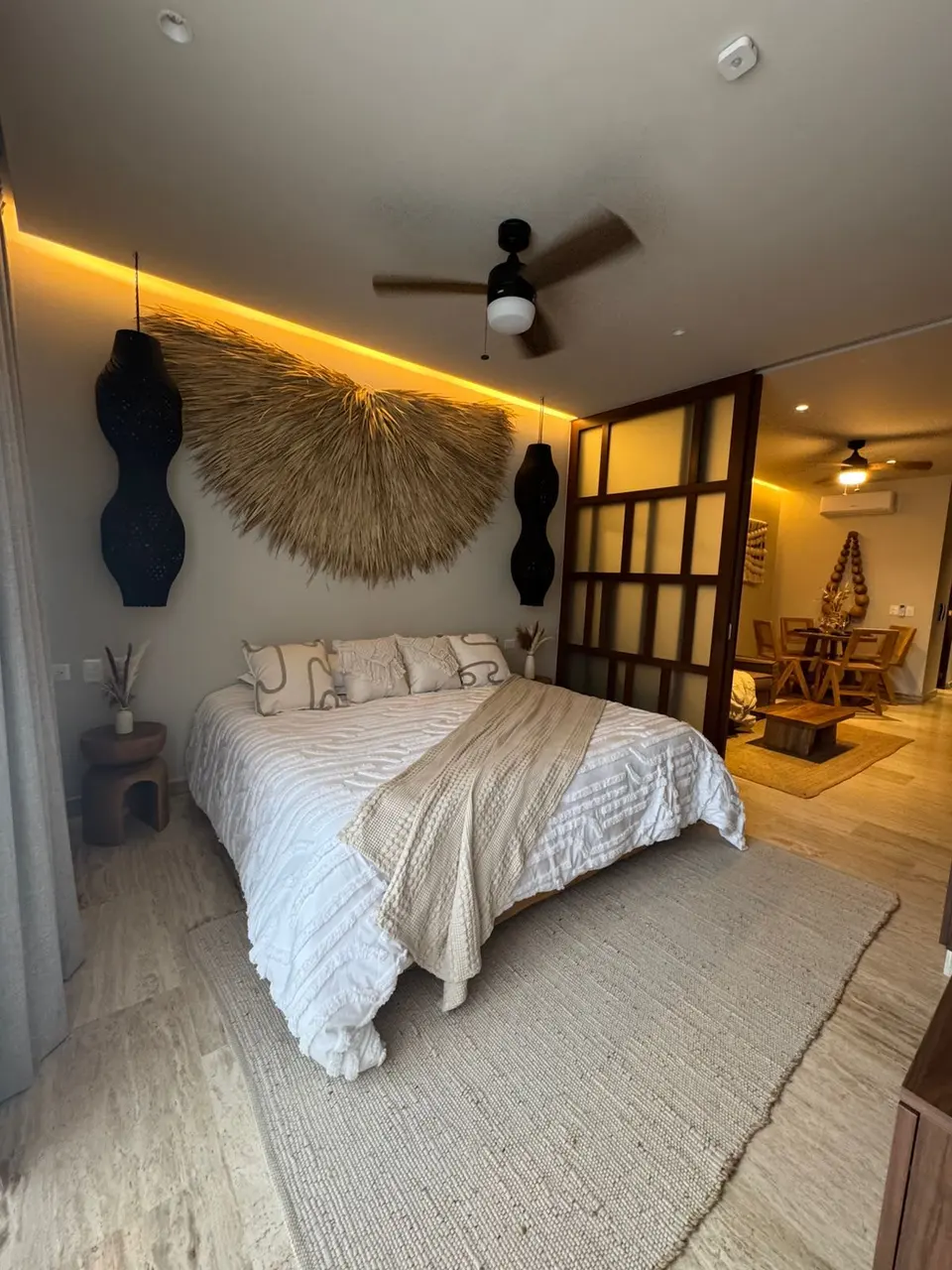 Room with modern design and a comfortable king bed.